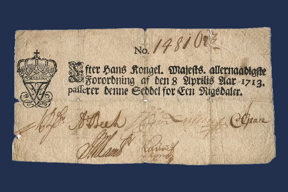 I 1713 kom de første danske pengesedler. Sedlerne skulle have samme værdi som mønterne, men kunne ikke veksles til mønter. Danskerne havde ingen tillid til papirpengene, og kursen faldt derfor til langt under møntværdien. (Foto: Danmarks Nationalbank)